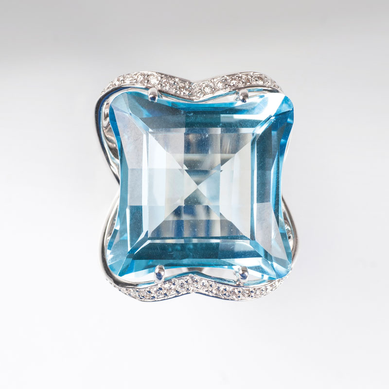 A blue topaz diamond ring