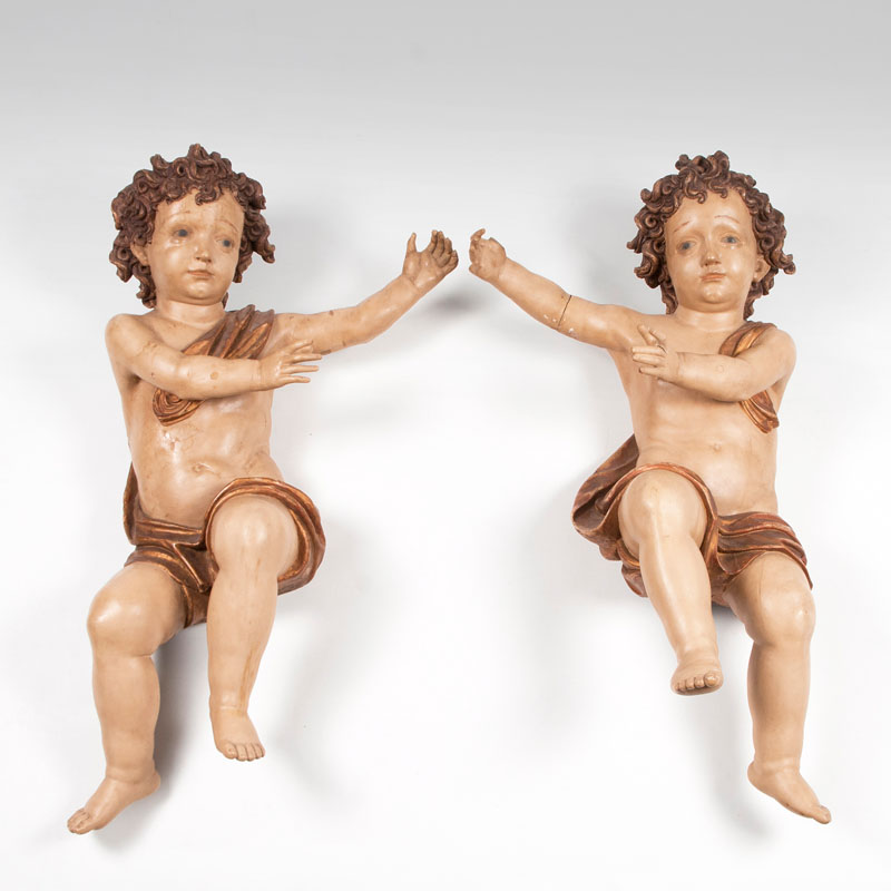 A pair of floating baroque putti
