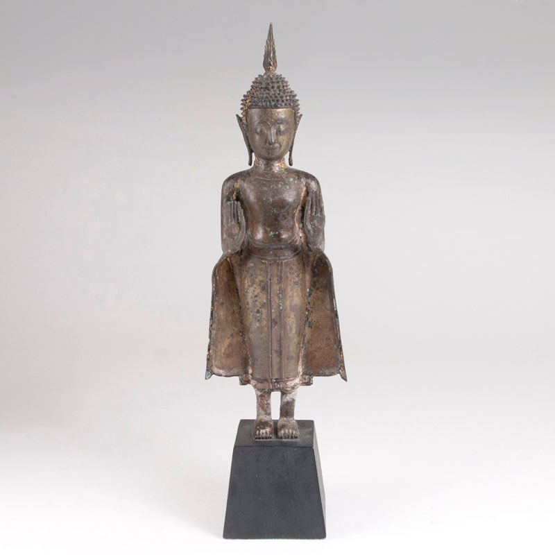 A bronze of standing buddha Shakyamuni
