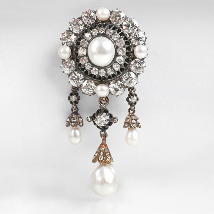 A fin-de-siècle diamond brooch with natural pearls