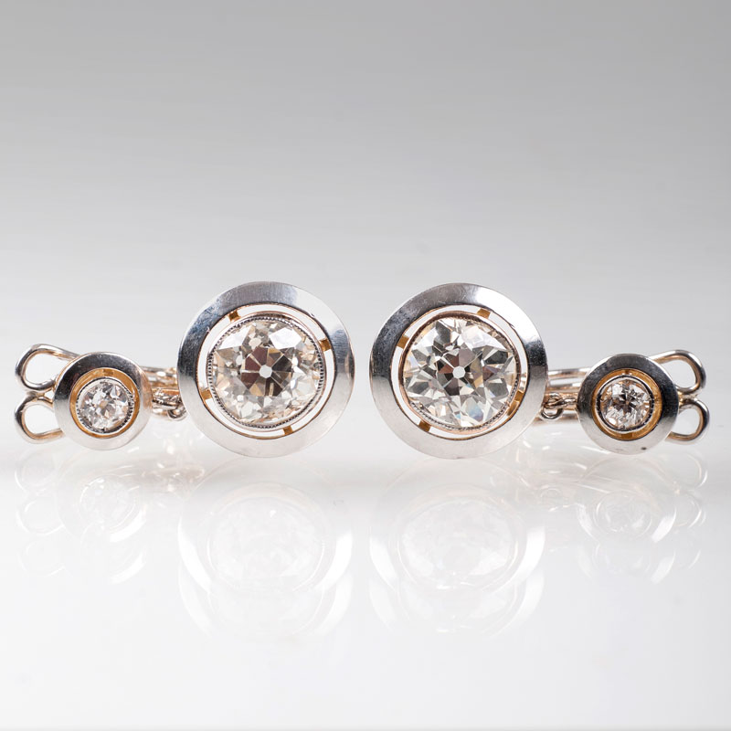 A pair of highcarat old cut diamond earrings