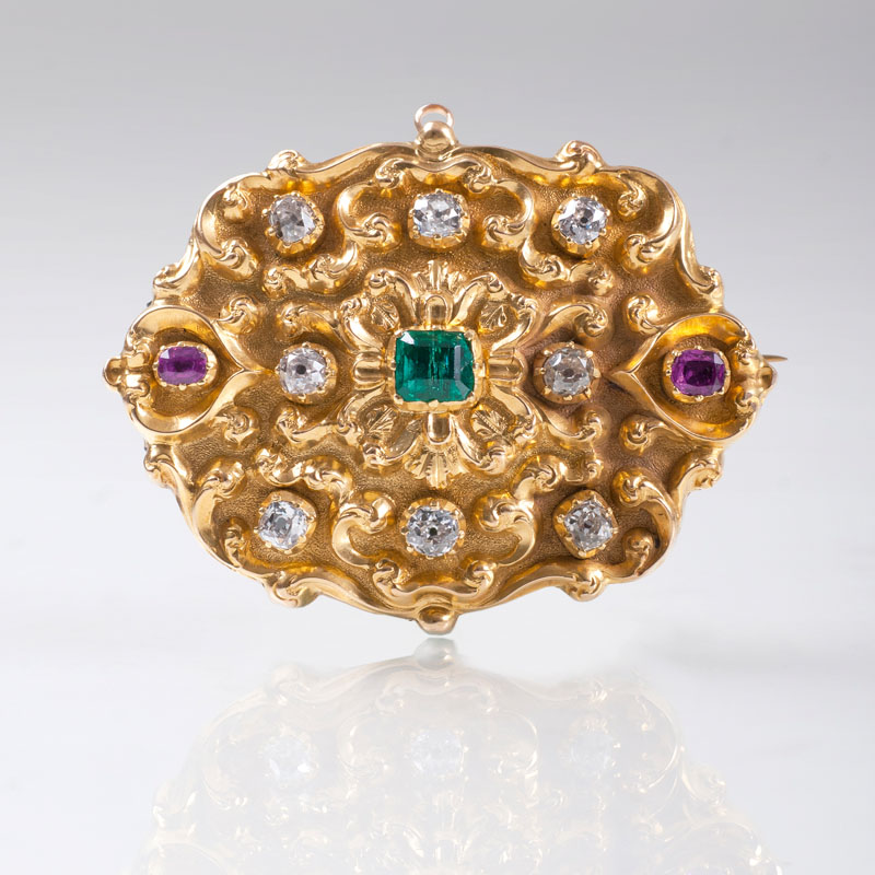 A golden pendant with old cut diamonds, rubies and emerald