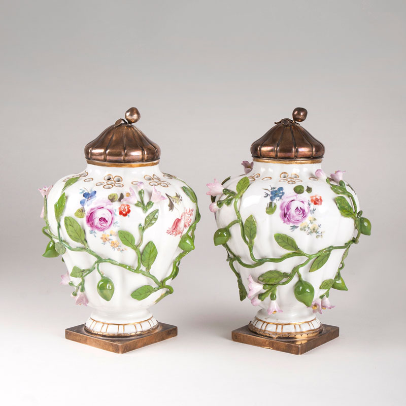 A pair of gadrooned potpourri vases with silver mount