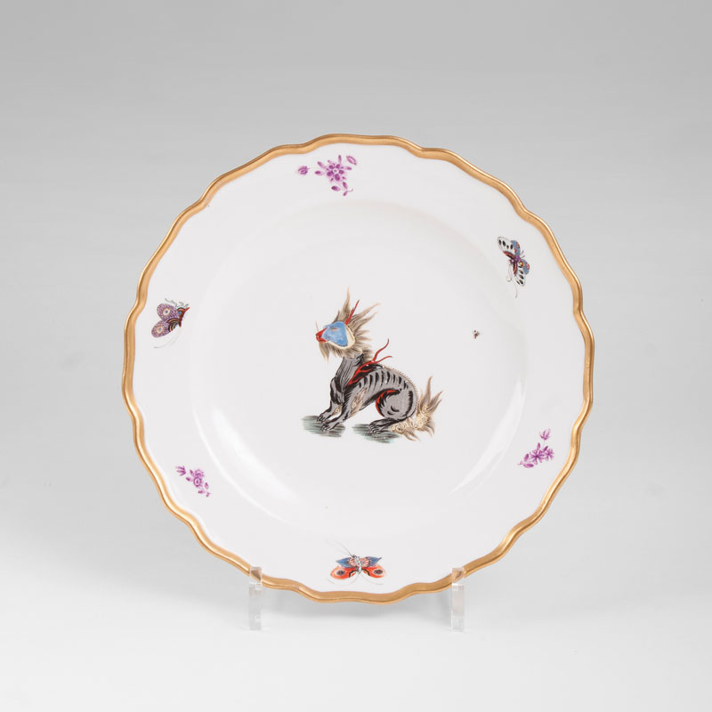 A magnificent plate with a mythical creature in the style of Löwenfinck