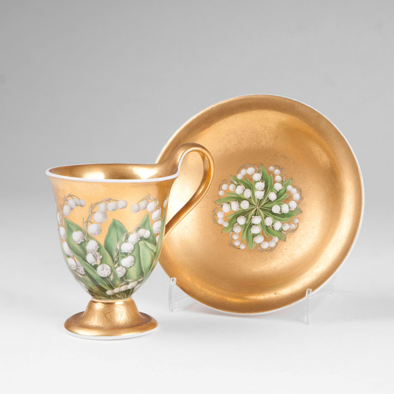 A bell-shaped beaker finely painted with lillies of the valley