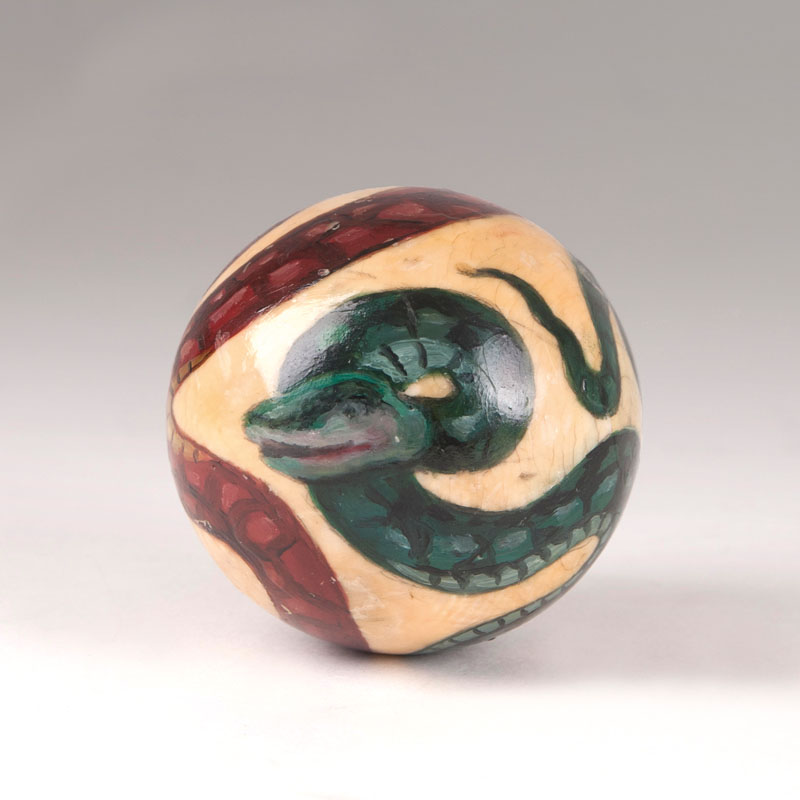 A billiard ball with snake motif