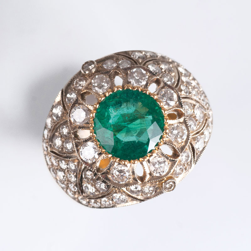 An emerald diamond ring