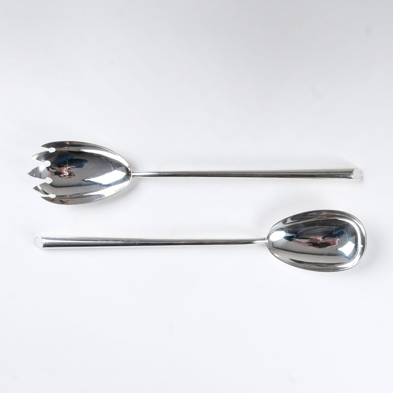 A modern pair of salad servers