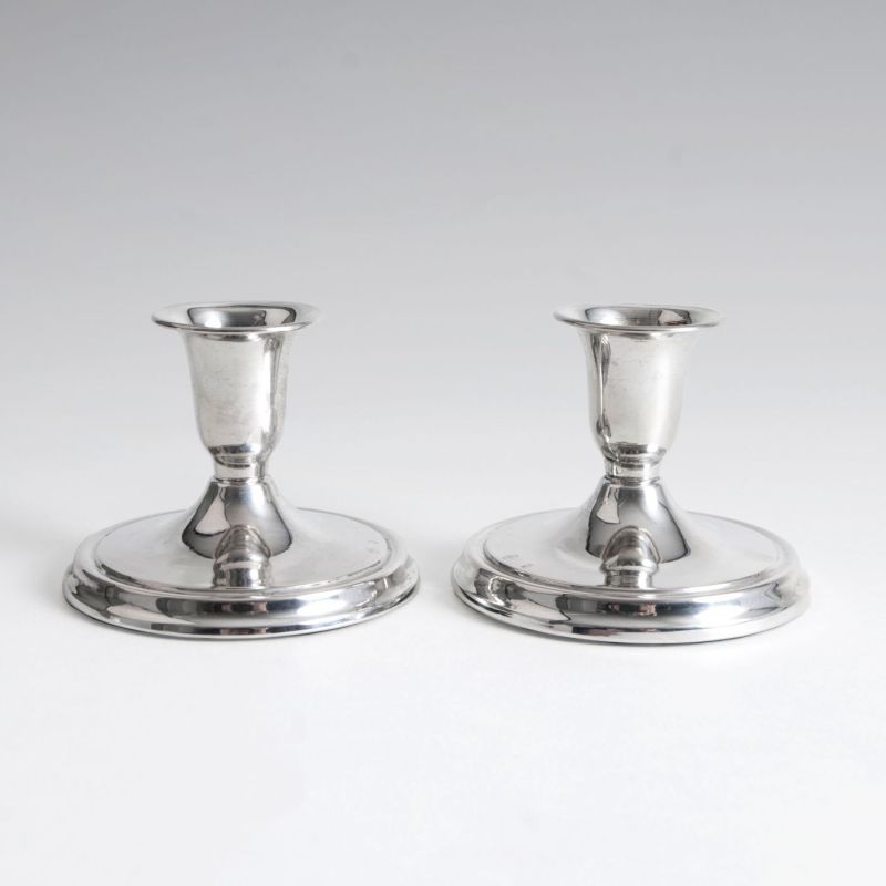 A pair of small candle holders