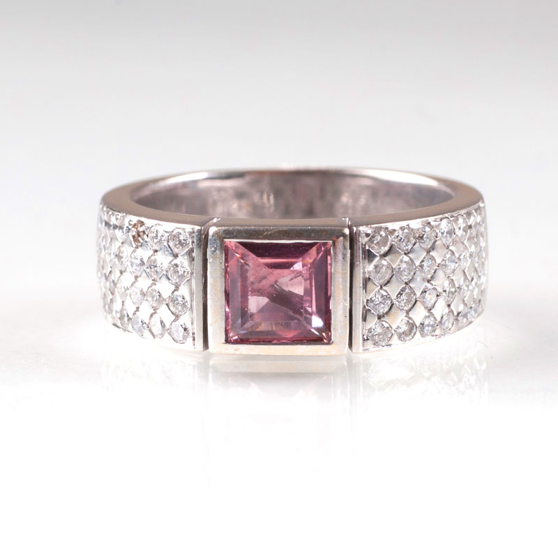 An amethyst diamond ring