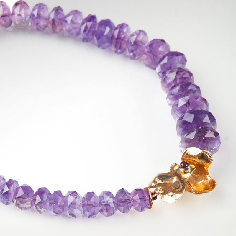 An amethyst necklace with decorative clasp
