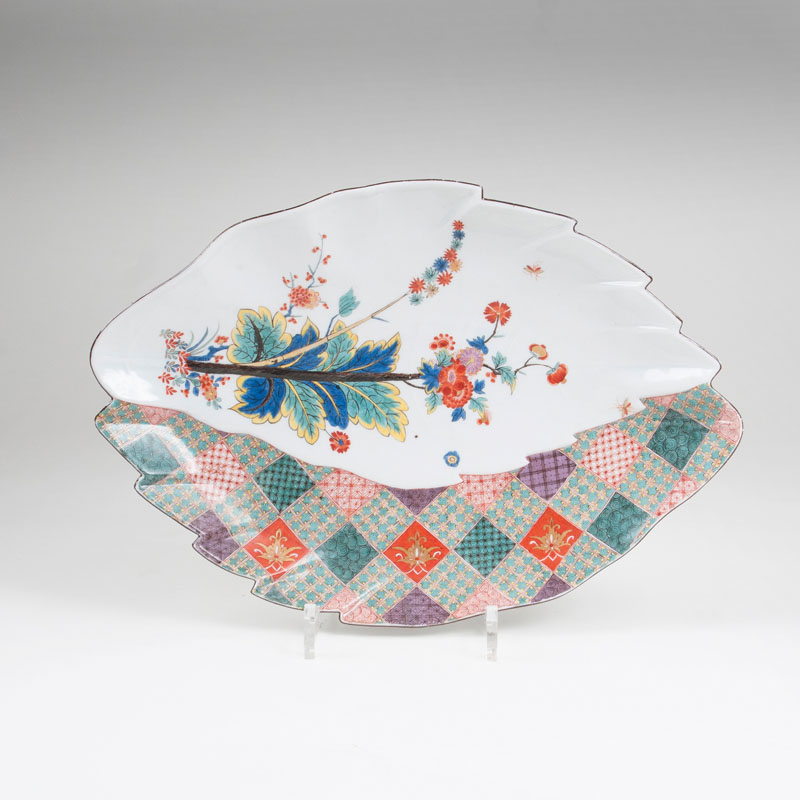 A rare and large leaf-shaped dish with chequered pattern and indian flower twig