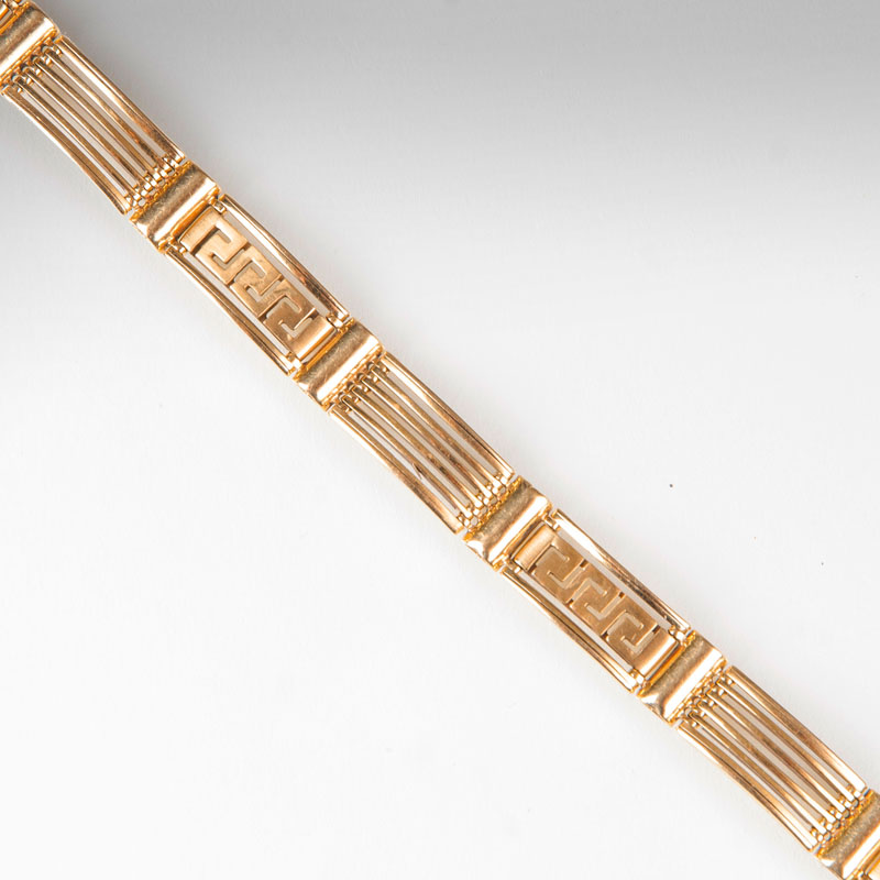 A golden bracelet with mäander ornaments