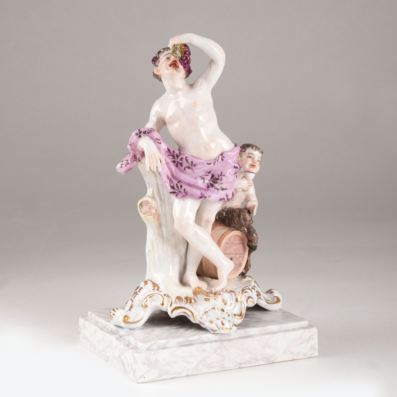 A porcelain figure 'Bacchus with satyr boy'