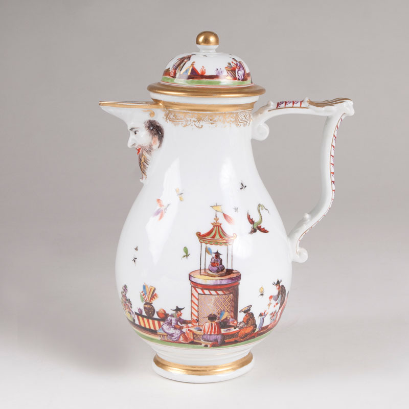 A coffee pot with reliefed mask and Chinese scenes by the Höroldt-workshop
