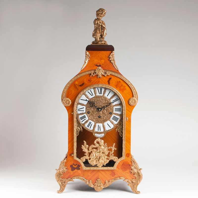 A mantel clock in baroque style with Westminster striking mechanism by Hermle