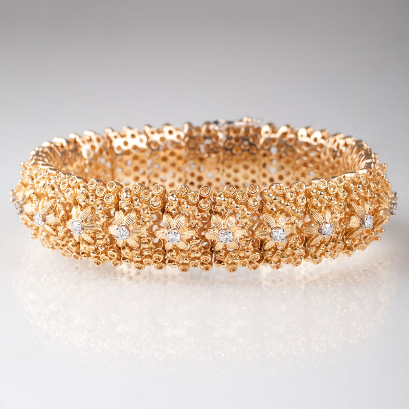 A diamond bracelet with ornaments of flowers