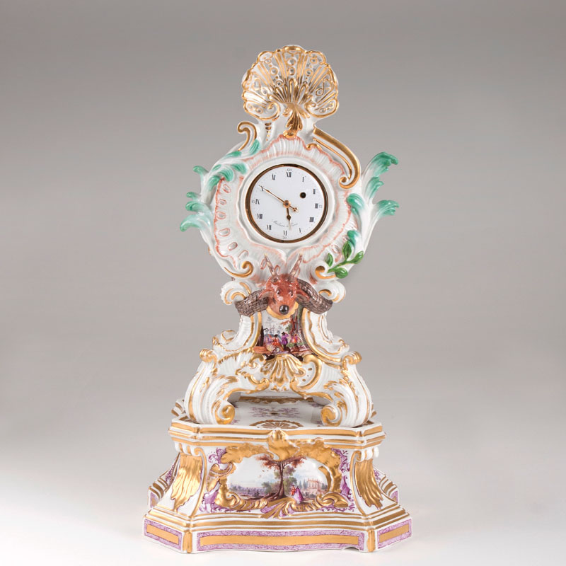 An extraordinary courtly porcelain desk clock with accompanying base