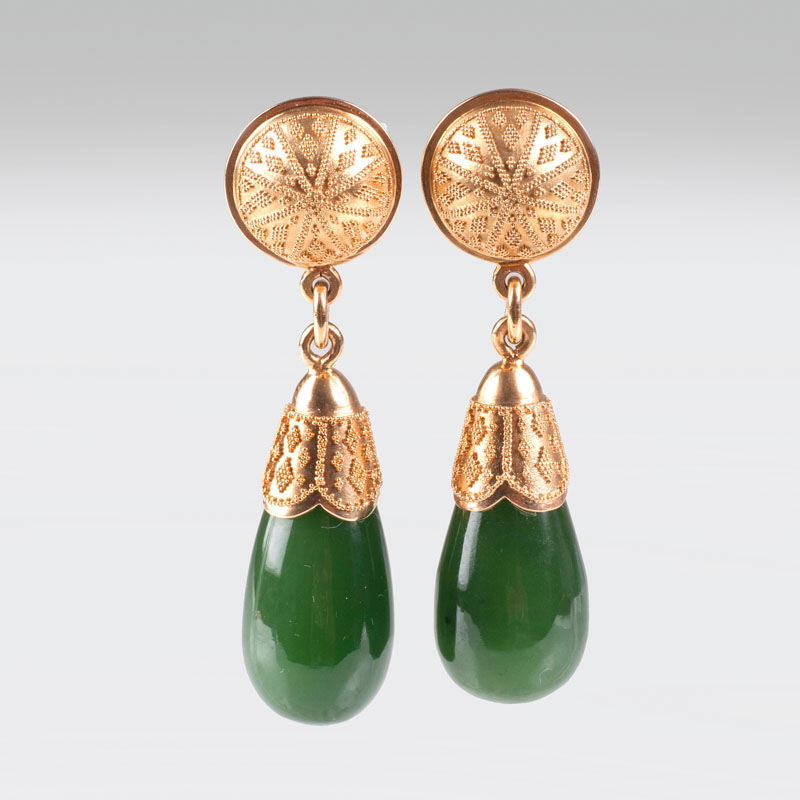 A pair of jade earrings with filigree ornaments