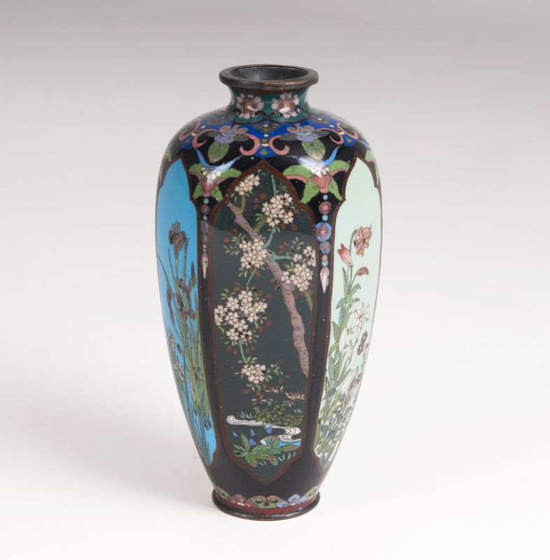 A small polygonal Cloisonné Vase with flowering shrubs