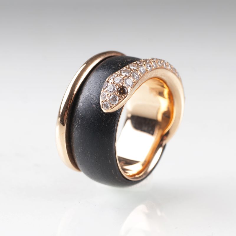 A gold precious wood ring 'Snake' with diamonds by Leo Wittwer