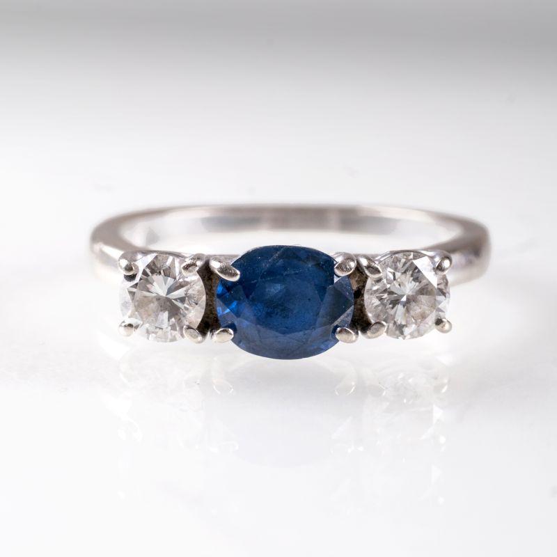 A petite sapphire diamond ring