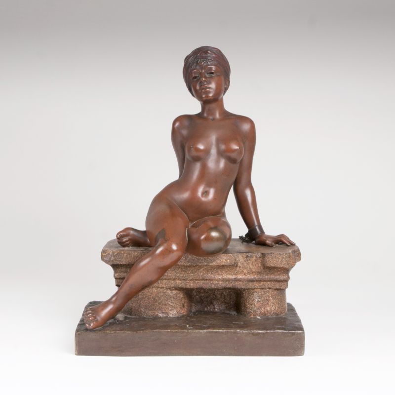 A bronze sculpture 'Young sitting slave'