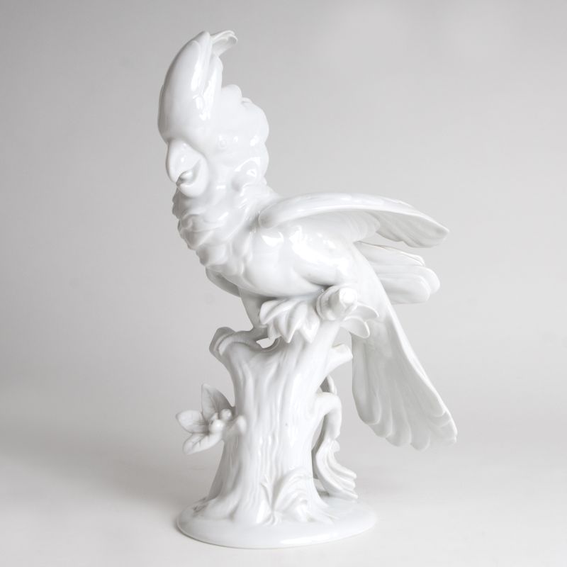 A porcelain figure 'Cockatoo sitting on a tree stump'