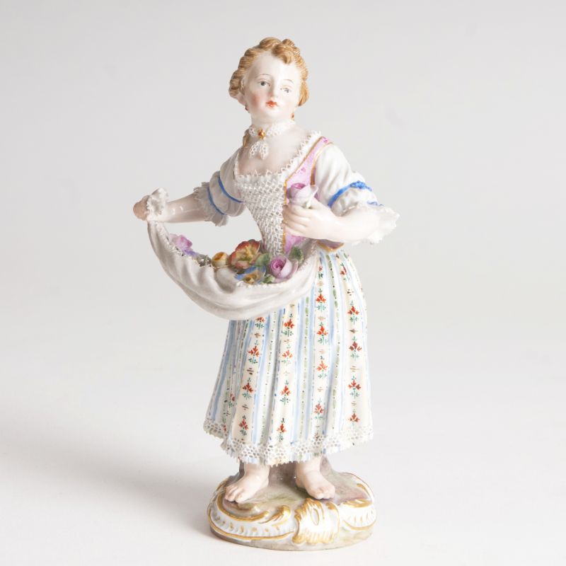 A porcelain figure 'Gardener child with flowers'