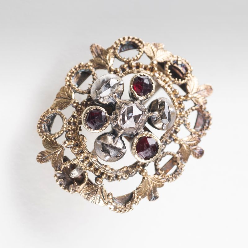 A small antique garnet diamond brooch