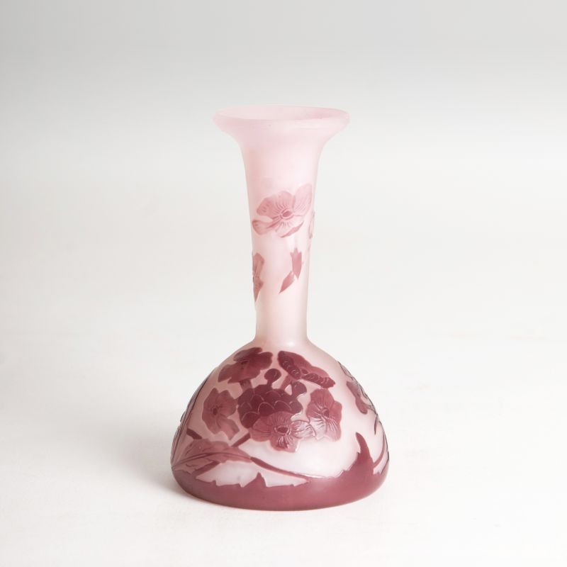 A miniature vase 'soliflore' with primroses