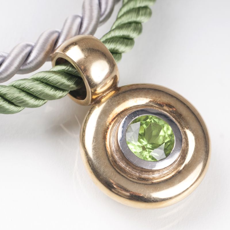 A golden pendant with peridot and two cord necklaces - image 2