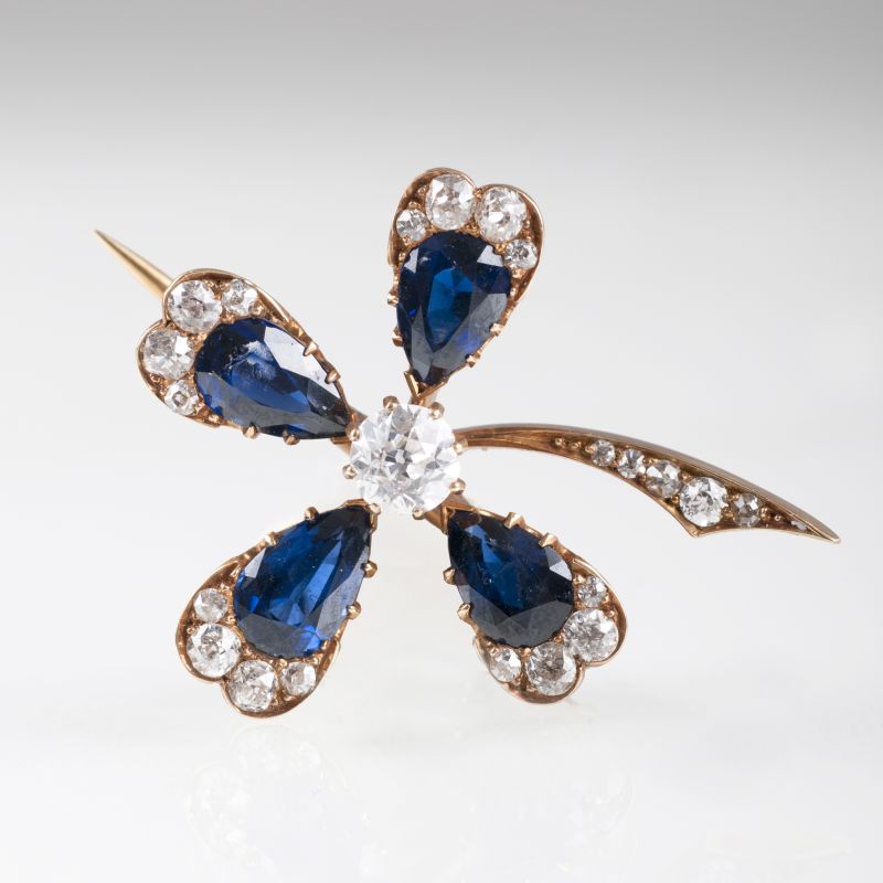 An antique brooch with sapphires and old cut diamonds