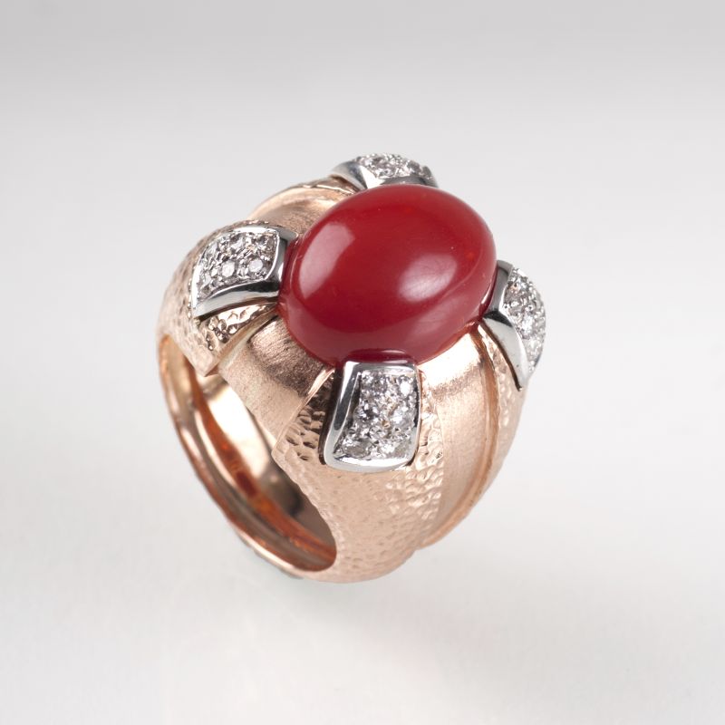 A large coral diamond ring