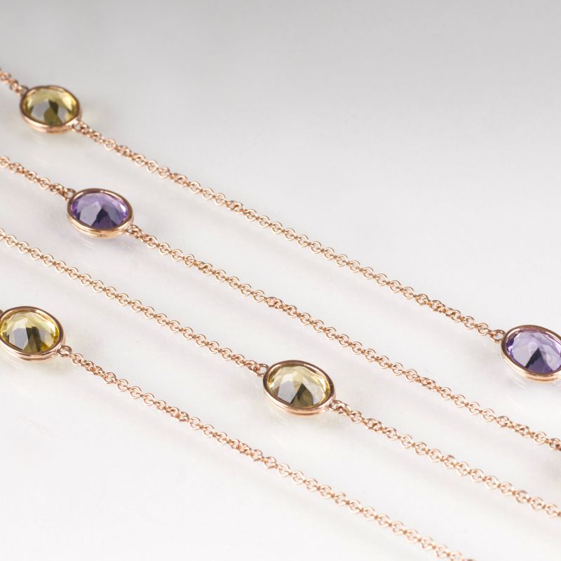 A long, modern necklace with citrine and amethyst