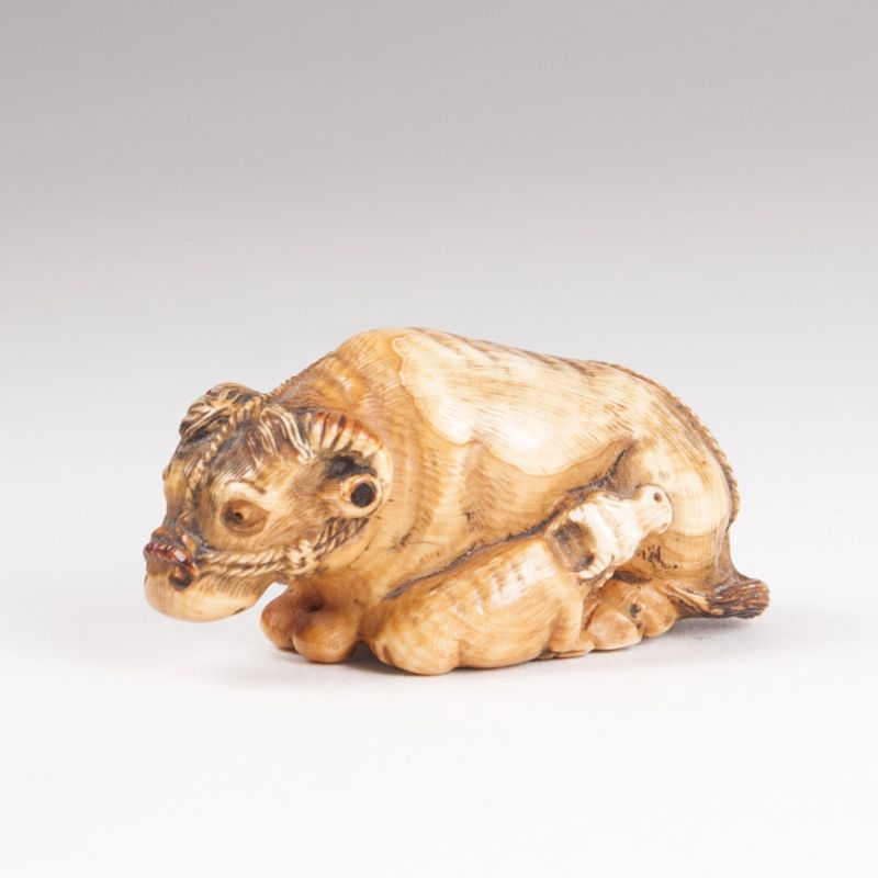 A netsuke 'Reclining cattle with little calf'