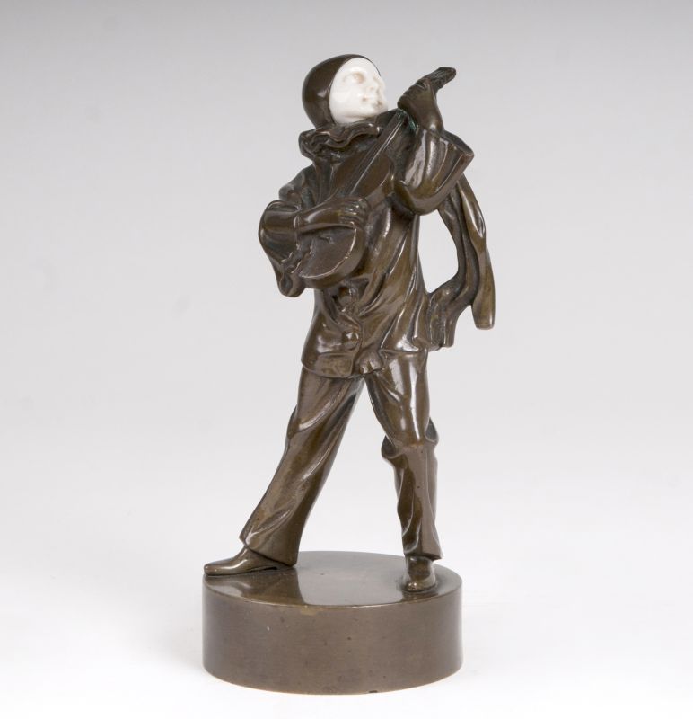 An art deco bronze 'pierrot playing the guitar'