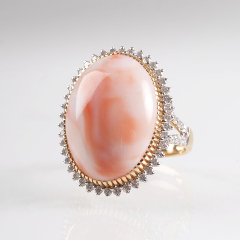 A coral diamond ring