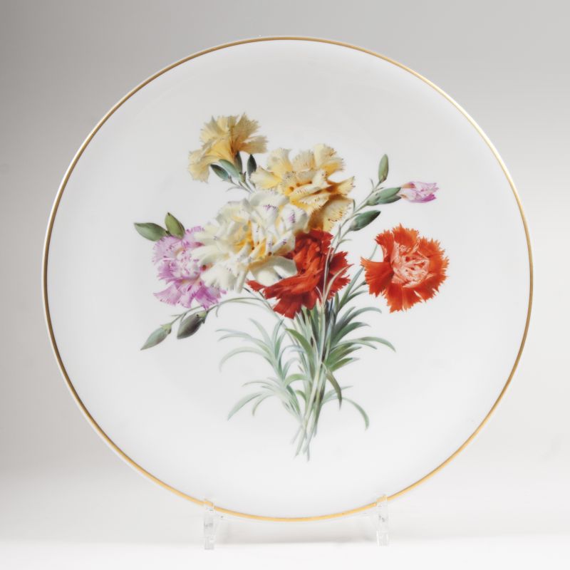 A Meissen plate with a bright bouquet of cloves