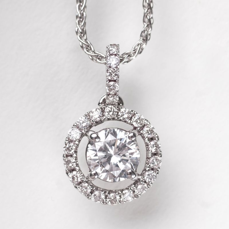 A solitaire diamond pendant with necklace