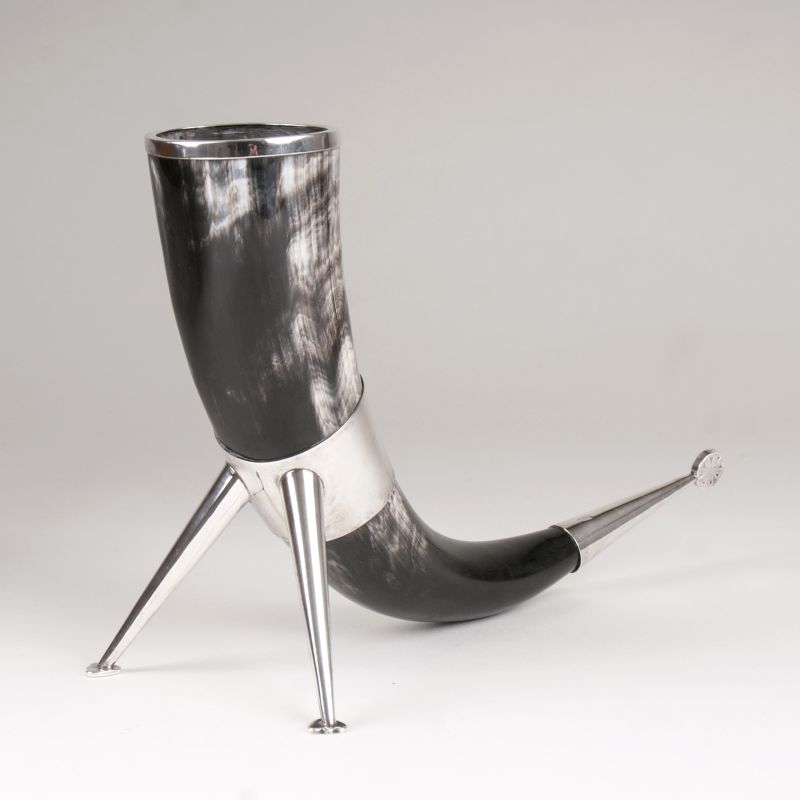 A traditional drinking horn with silver mounting