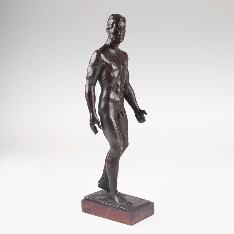 A bronze figure 'Walking male nude'