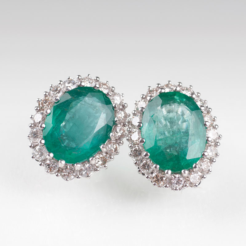 A pair of highcarat emerald diamond earrings
