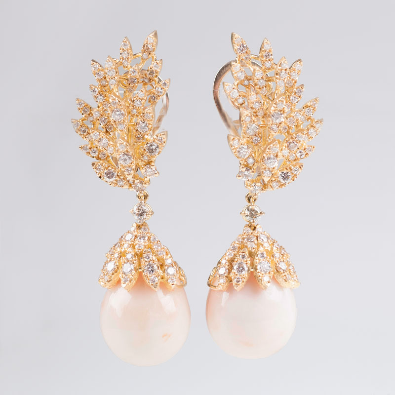 A pair of extraordinary coral diamond earpendants