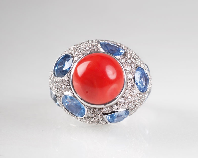 A large coral sapphire diamond ring