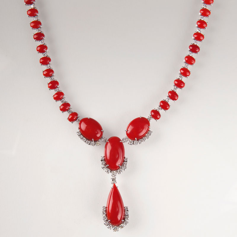 An opulent coral diamond necklace