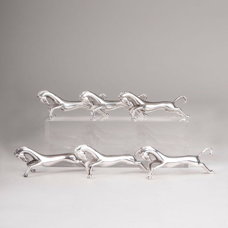 A set of 6 horse-shaped knife rests