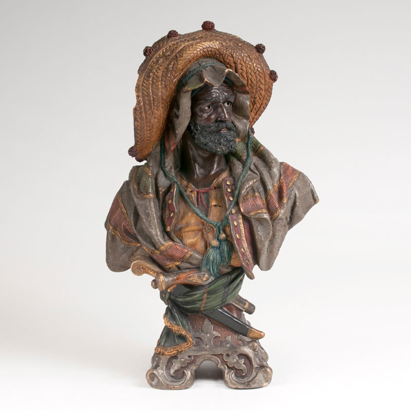 A terracotta bust of man in oriental dress