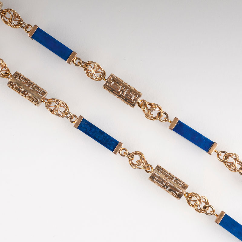 A golden necklace with lapi lazuli - image 2