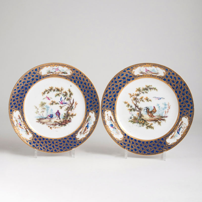A pair of plates with bird painting